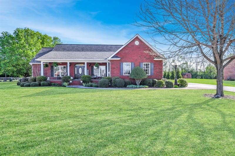beautifully maintained brick home on level landsca