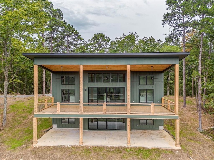 Rear view of property with board and batten siding and a porch