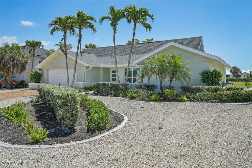 Ranch-style home featuring a garage, stucco siding