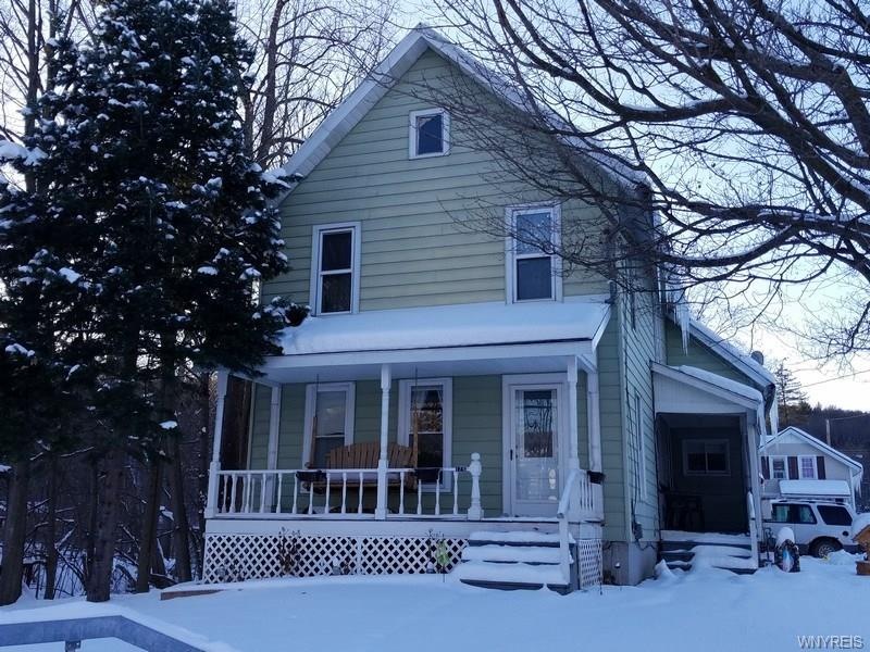 Front with Covered Porch on front and side.