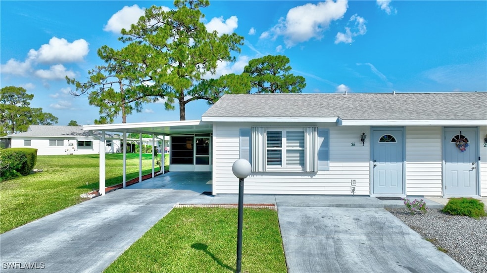 View of front facade with concrete driveway, a fro