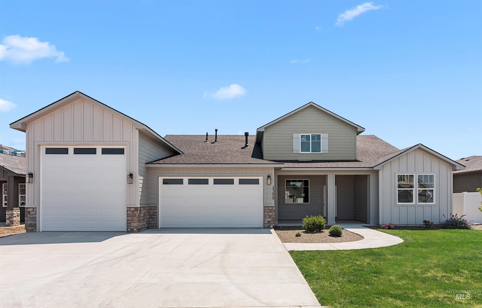 View of front of property with a shingled roof, an attached garage, board and batten siding, driveway, and a front lawn