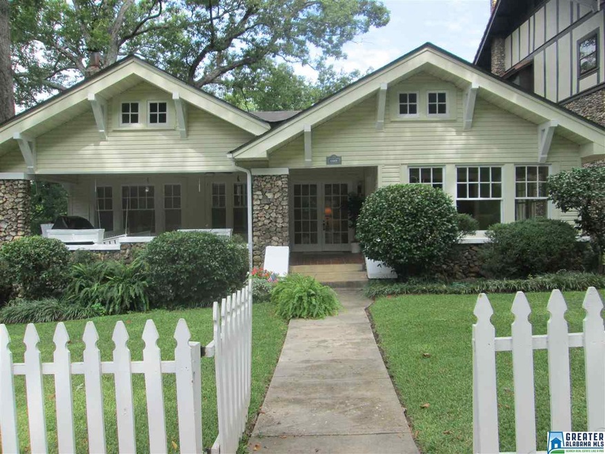 Cute picket fence welcomes you to the front yard a