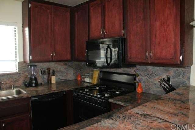 Kitchen is upraded with granite counters and backs