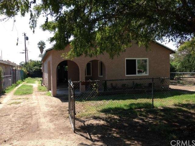 Front of house featuring dirt driveway on left to 