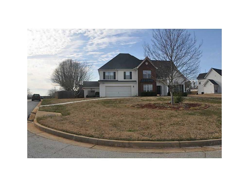 Exterior Front. Corner lot ~ this was the model ho