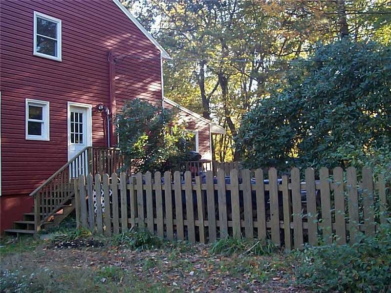 Exterior Front. Newly vinyl sided Colonial set way