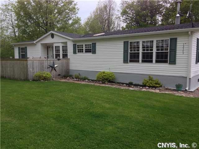 Exterior Front. Spacious home nestled in the woods