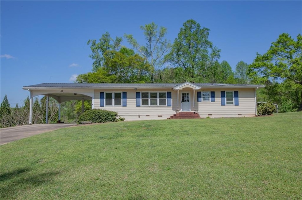 Ranch-style home with concrete driveway, crawl spa