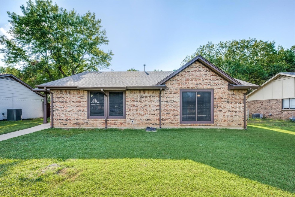 Ranch-style house with central AC unit and a front
