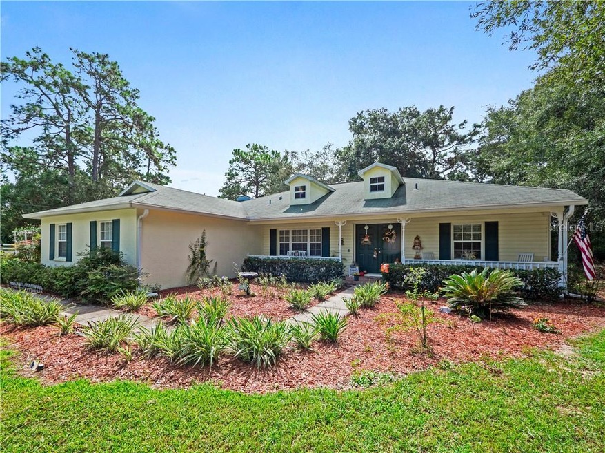 peaceful front porch and clean curb appeal is comp