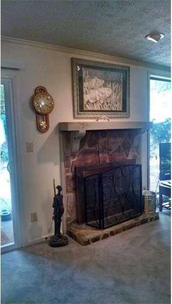 Real wood burning fire place is the focal point of