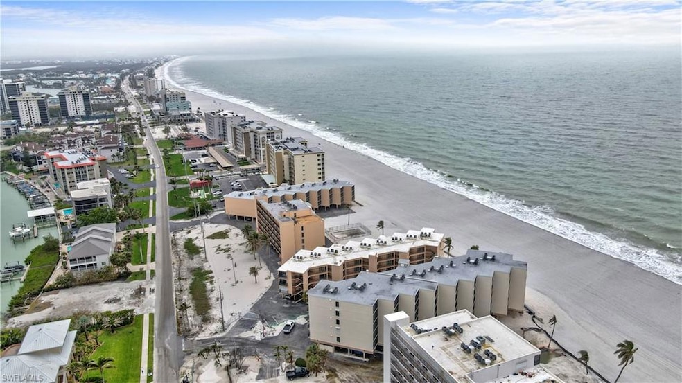 Aerial view with a city view, a view of the beach,