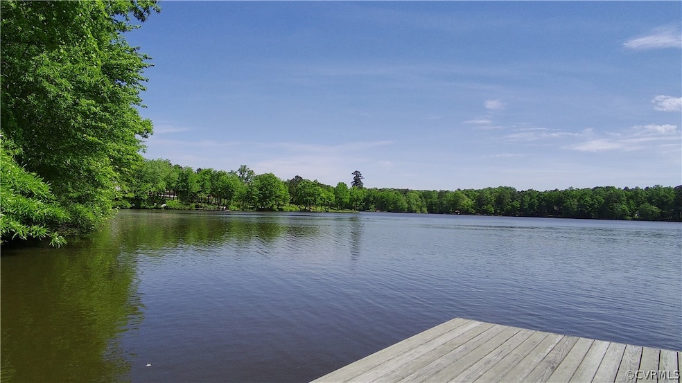 View of neighborhood dock with a water view