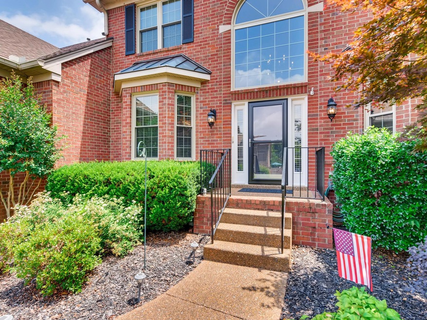 Front entry with new storm door and sidelight.