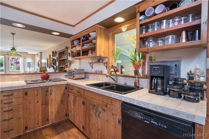 Kitchen w/ custom cabinetry, wood floors, and drop