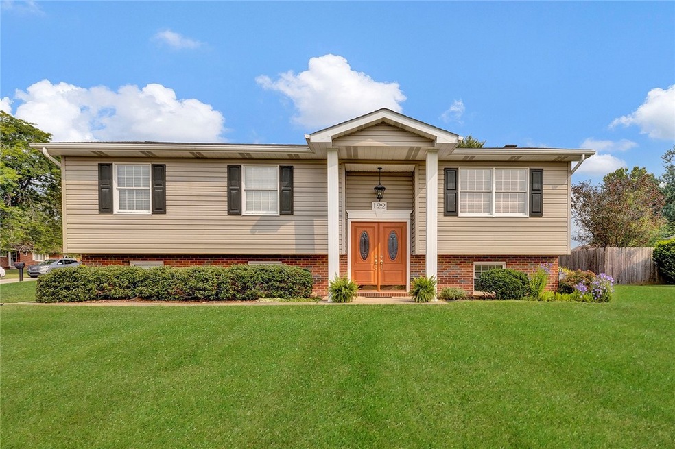 Stately curb appeal from the road for 122 Skyview