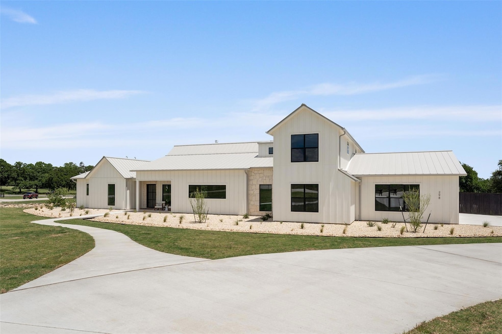 Modern inspired farmhouse featuring board and bat