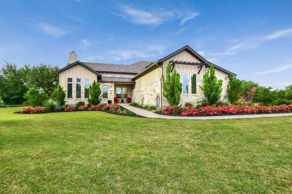 This elegant and beautifully landscaped home sits 