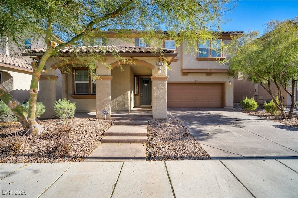 Mediterranean / spanish house featuring driveway,