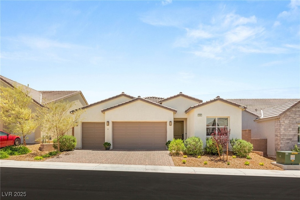 View of front of home featuring a garage, decorati
