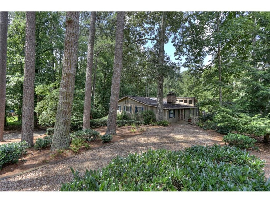 Scenic walk up to the front of the home nestled am