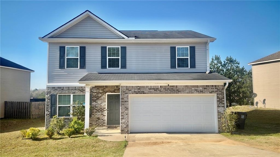 View of front of house featuring brick siding, fen