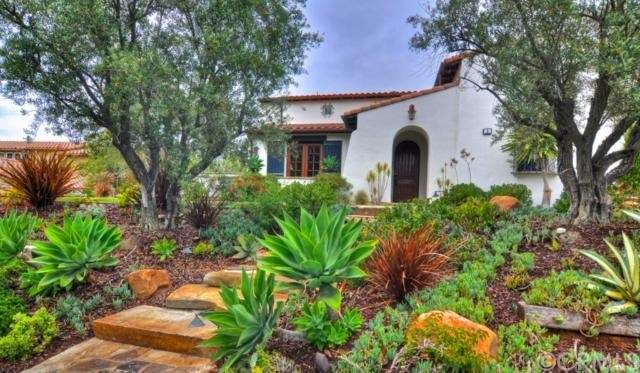 Spanish estate in Covenant Hills with lush landsca