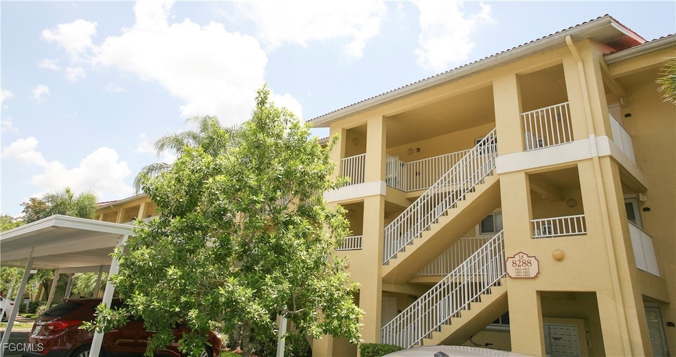 View of apartment building / complex featuring sta
