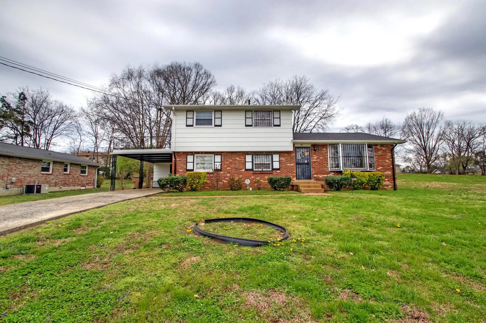 Large 0.37 acre lot. Concrete drive, attached carport, sundeck above carport accessed from master bedroom.