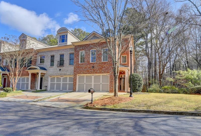 Welcome Home to this End-Unit Townhome in Gated My