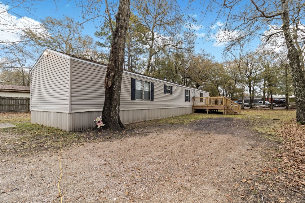 LOCATION!!! LOCATION!!! LOCATION!!! UNRESTRICTED!!!  2.01 LOW TAXES!!! .66 ACRE!!!  1600 SF WORKSHOP WITH PAINT BAY, 2 CAR GARAGE, 2 CAR CARPORT, AND 1/2 BATH!!!  Beautiful 3 Bedroom, 2 Bath spacious open concept home with wood burning Fireplace.  You will love the big kitchen with lots of counter space and built in glass cabinets off the dining room.