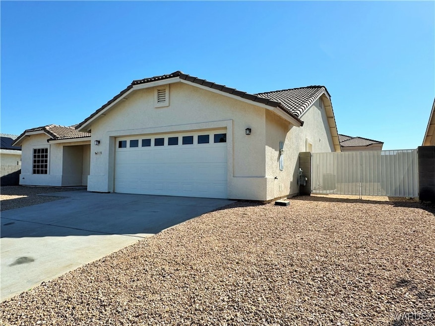View of front of property featuring a tiled roof,