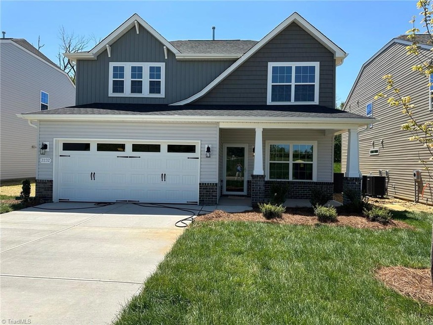Beautiful Elevation with curved roof, shakes and board n batten siding