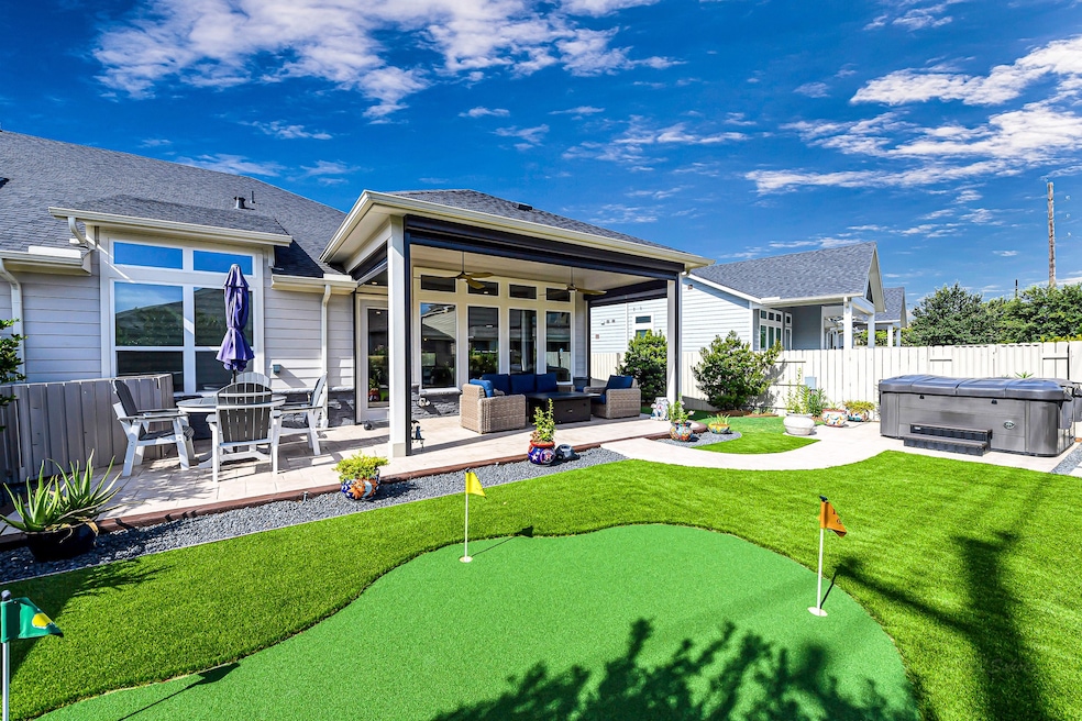 A backyard you can enjoy. A four hole putting gree