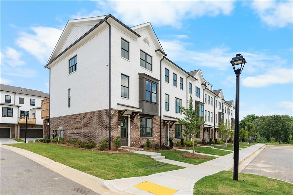 Glendale Floor Plan - Brand New Home by The Providence Group! View of building (End Unit 190)exterior with a residential view