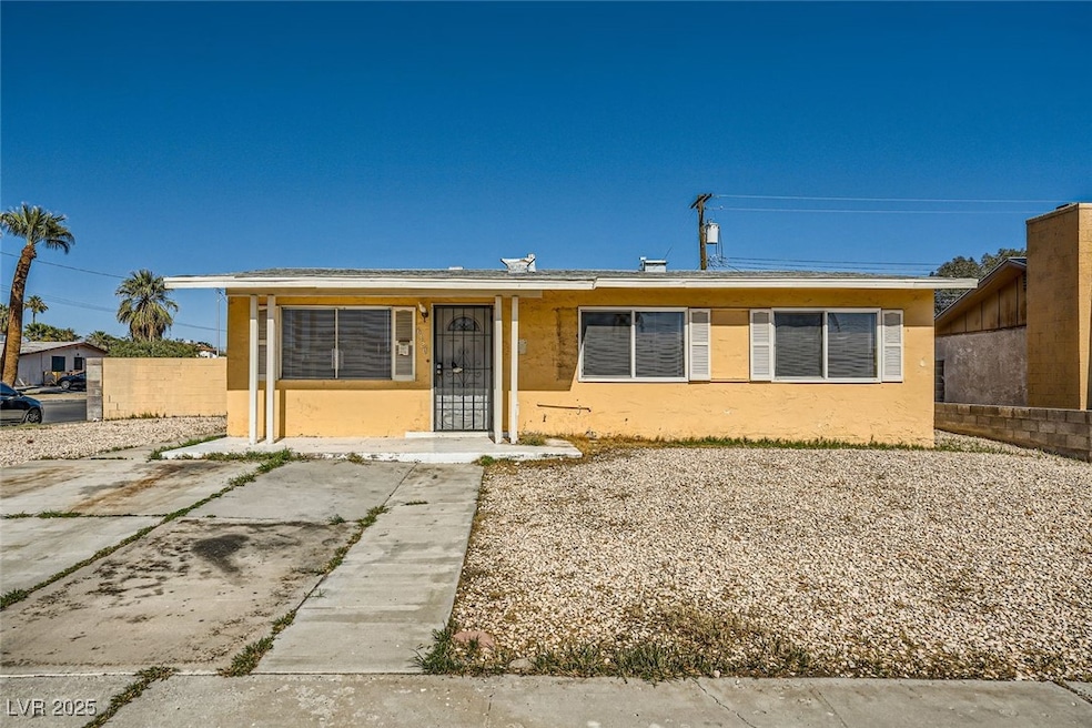 View of front of home with fence and stucco siding