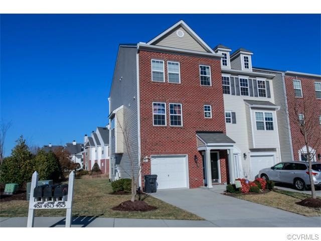 This brick front, end unit, 3-story townhome is a former model open featuring many upgrades!