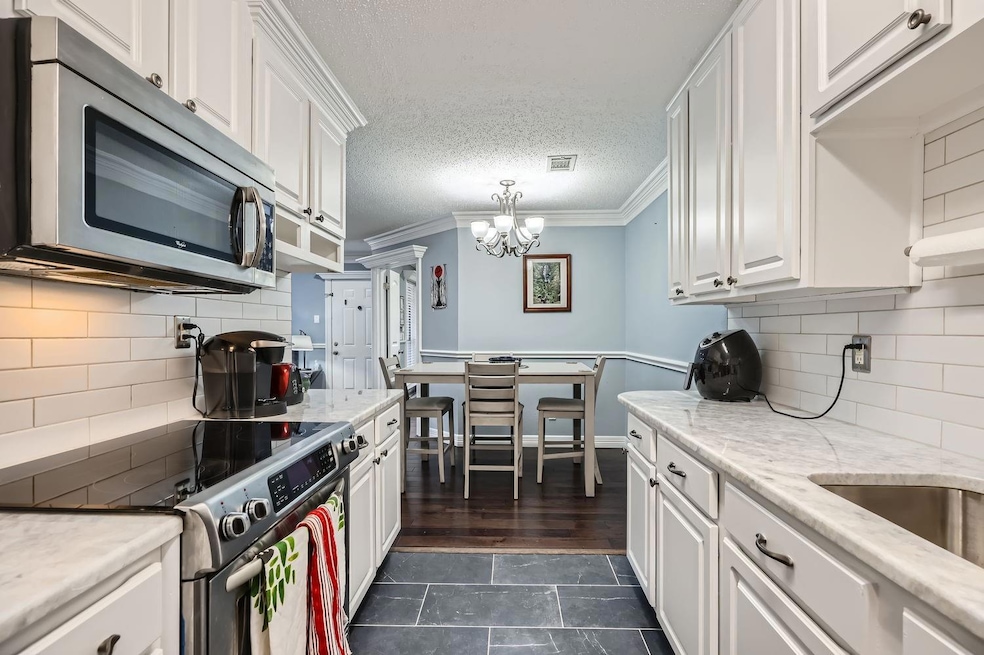 Kitchen with appliances with stainless steel finis