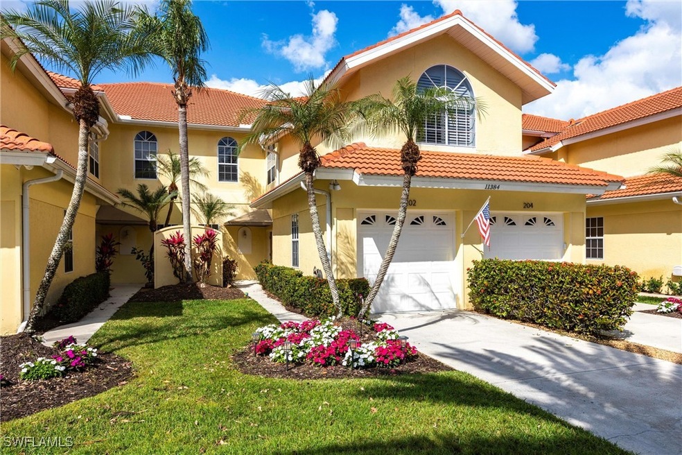 Mediterranean / spanish-style home featuring a gar