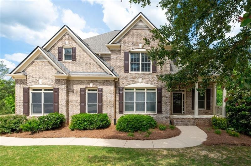 This beautiful 3 sided brick home boasts a full ba