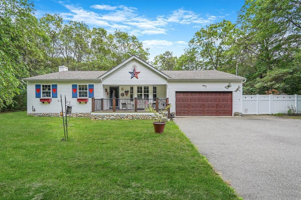 Ranch-style house featuring covered porch, driveway, a garage, a chimney, and a shingled roof