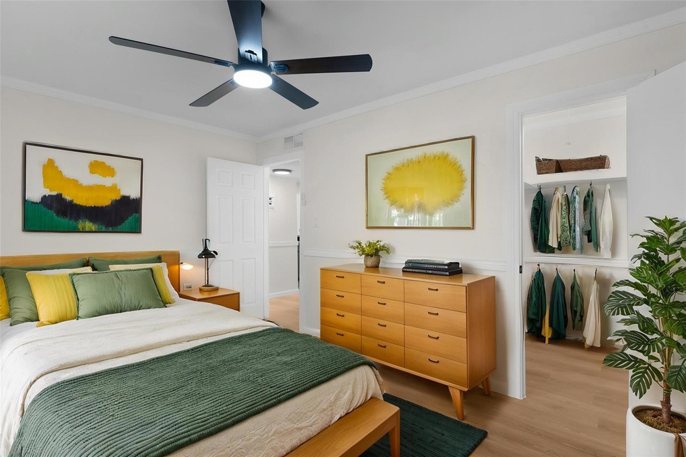 Bedroom featuring light wood-type flooring, a cei