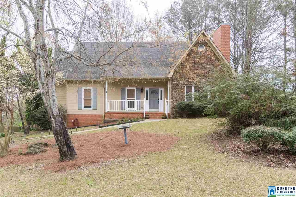 Charming curb appeal with front porch, and brick f