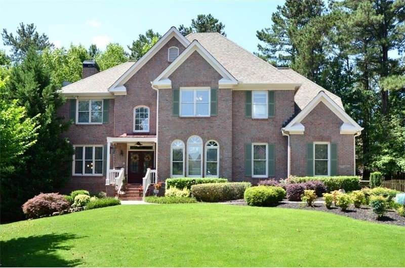 This three sided brick / cement siding home boasts