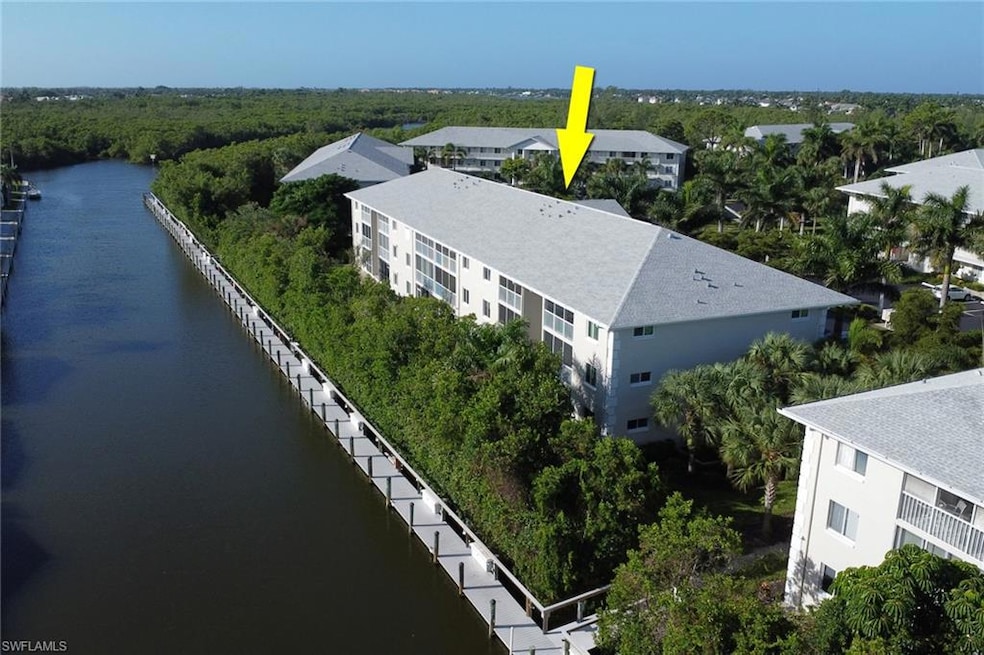 Bird's eye view of a nearby body of water and apartment complex / building
