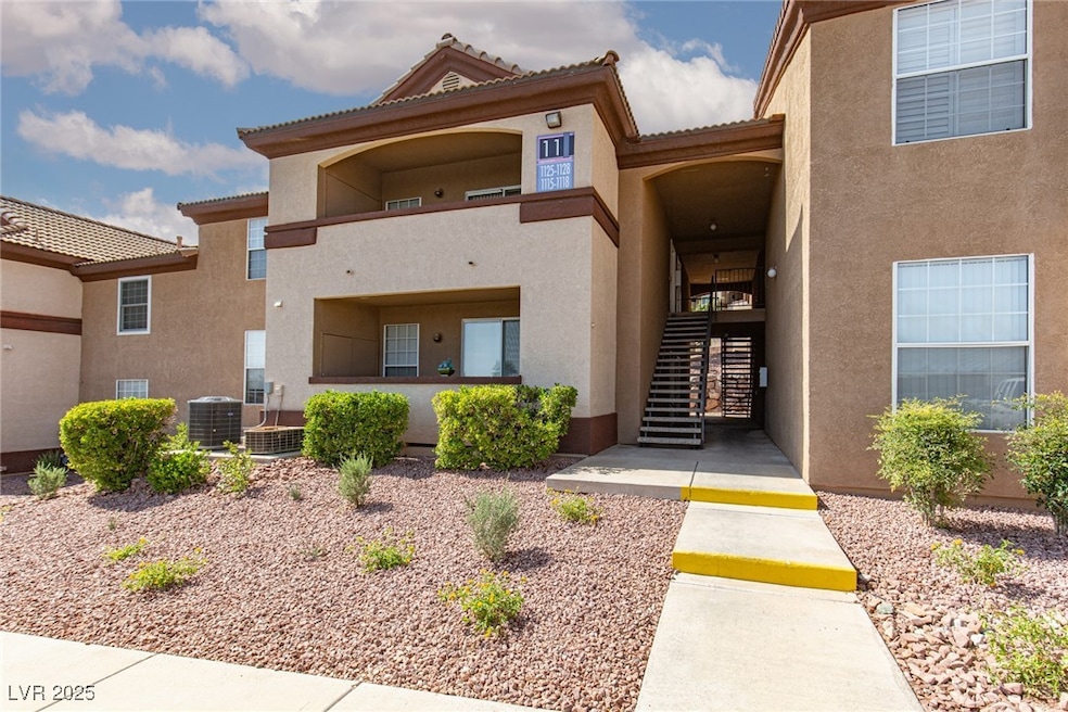 Property entrance with stucco siding and a tiled r