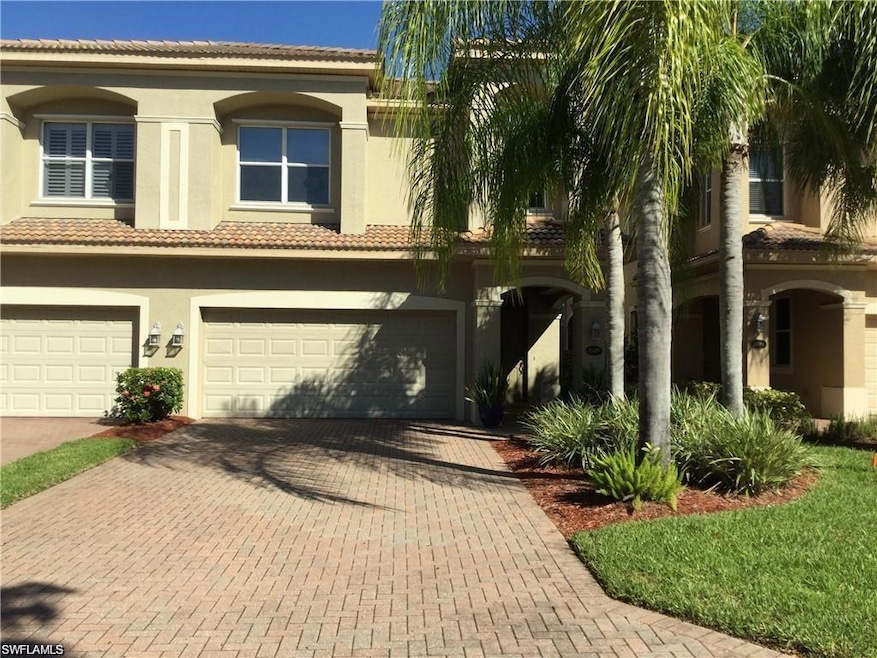 View of front facade featuring a garage, decorativ