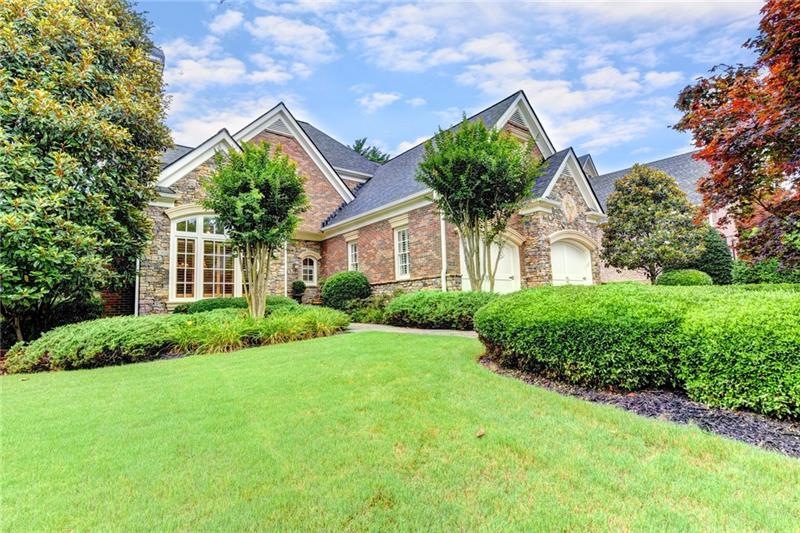 EXQUISITE BRICK AND STONE HOME ON LEVEL LOT AND QU