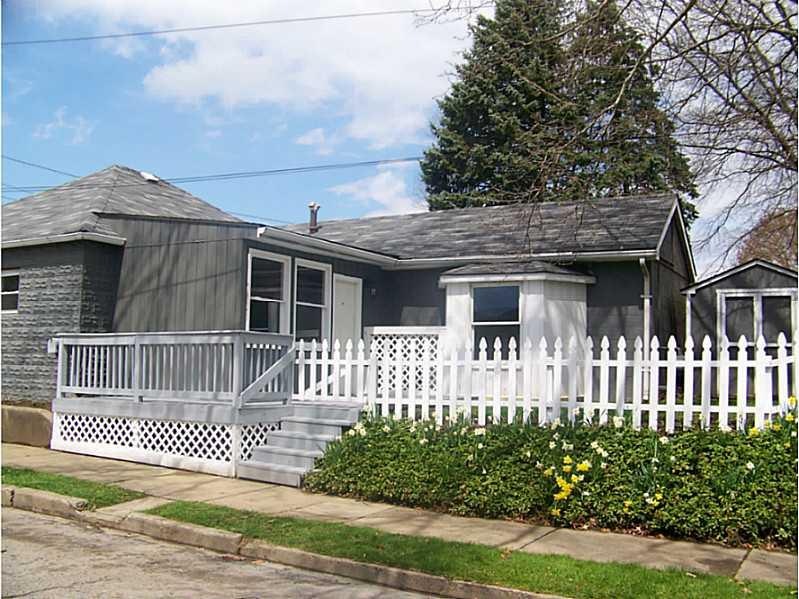 Exterior Front. Freshly painted with a new roof, f